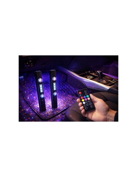 Two wireless RGB light bars with the remote control in a car interior