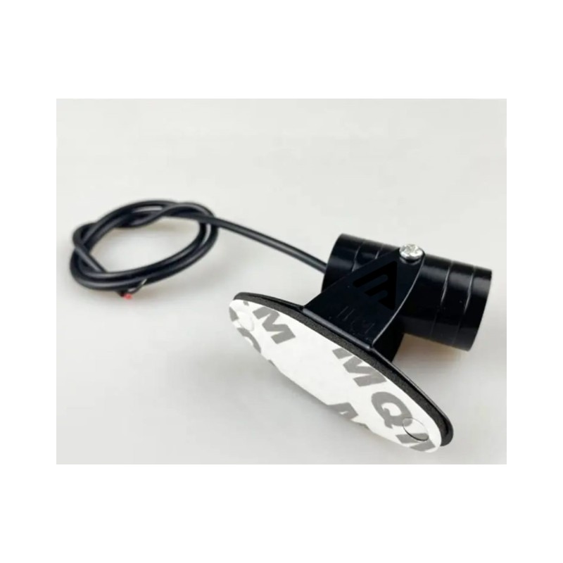 Projector with supplied adhesive mounting pad